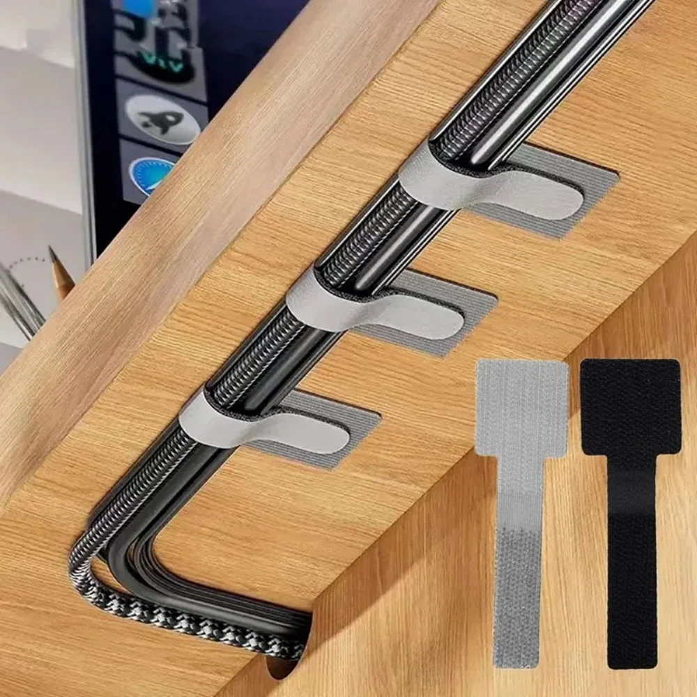 Reusable velcro cable ties routing cables under a desk