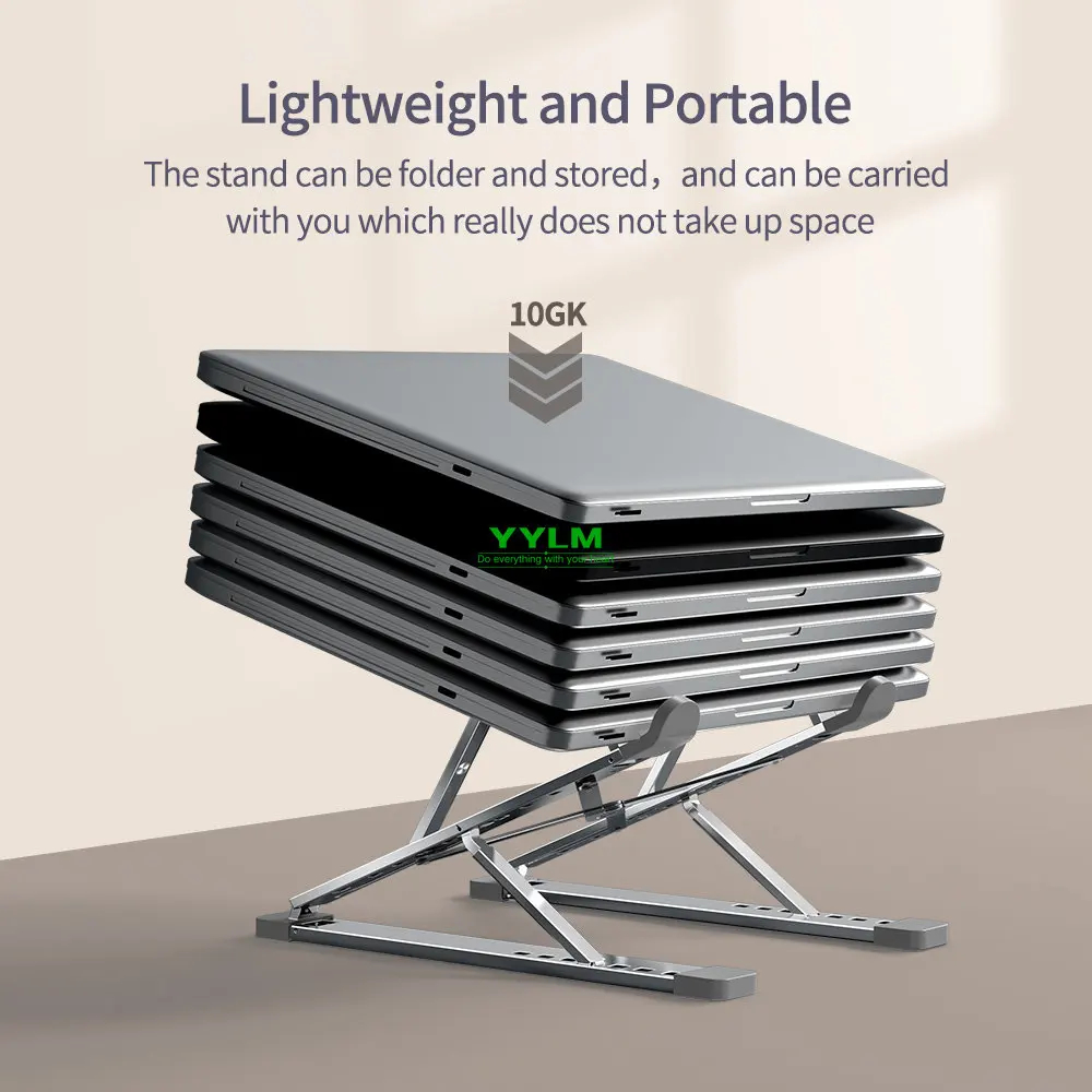 An aluminium laptop stand on a small desk with space underneath
